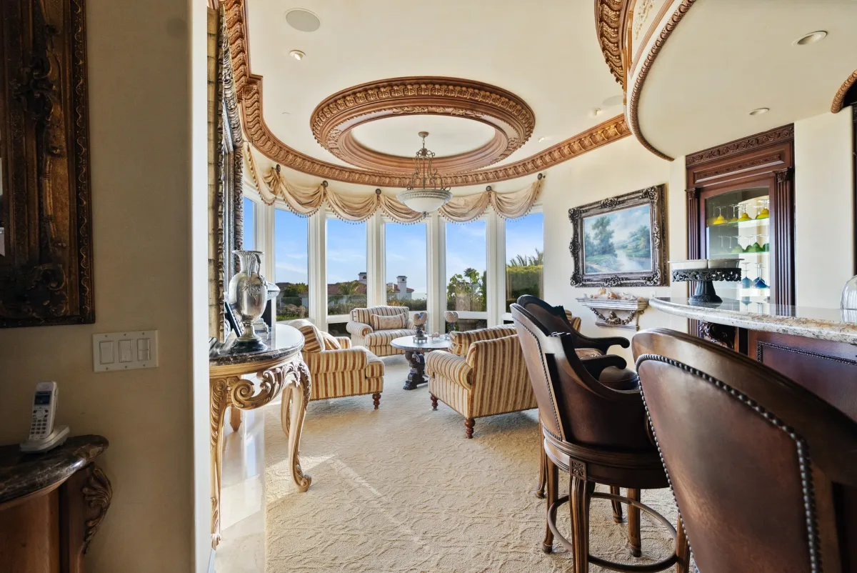 Curved bar and windowed sitting area overlooking the coast